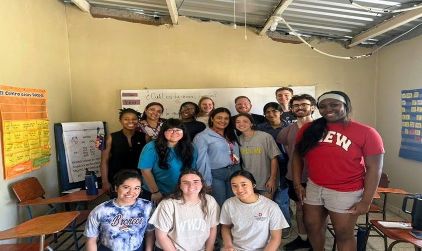 A group of volunteers with Buck-I-SERV at Ohio State University gathers at the classroom at the Montana de Luz children home in Honduras.